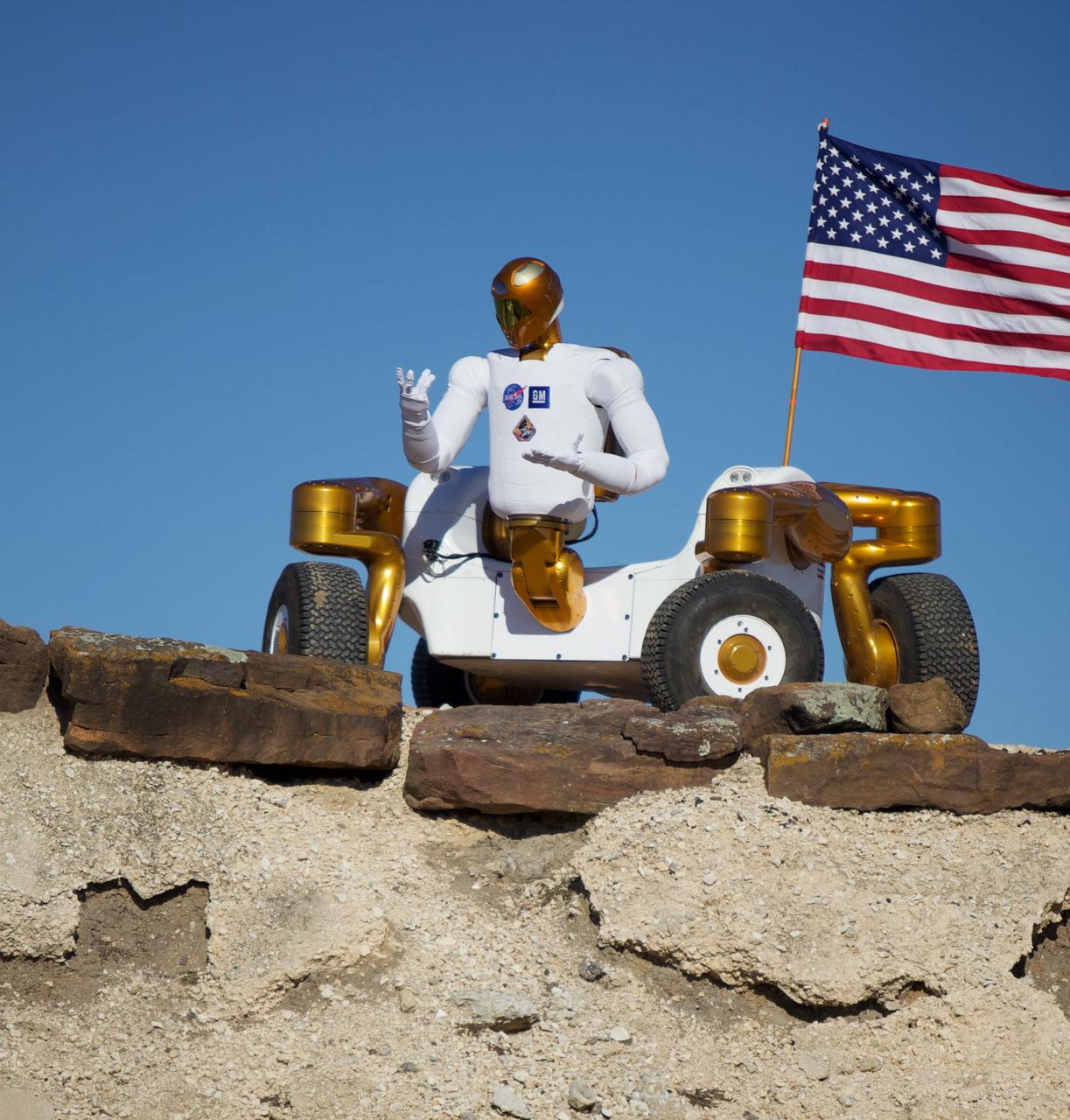 JSC2011-E-017945 (February 2011) --- Robonaut 2 poses atop its new wheeled base, Centaur 2, at the Johnson Space Center Planetary Analog Test Site. The Centaur base builds off of lessons learned through the Space Exploration Vehicle, a rover for astronauts, and could allow the dexterous humanoid robot to help with the future exploration of distant planetary surfaces. Photo credit: NASA or National Aeronautics and Space Administration