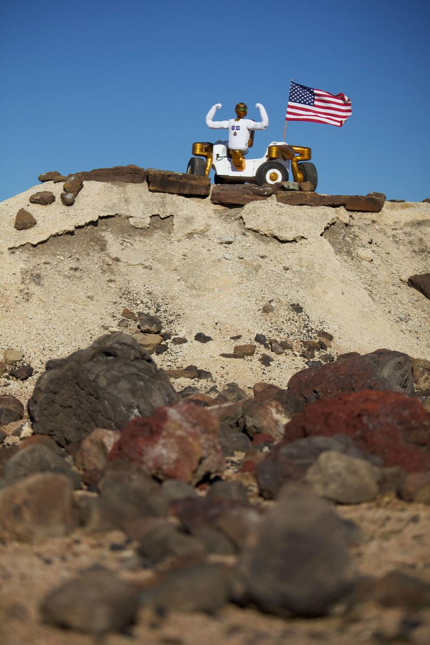 JSC2011-E-017946 (February 2011) --- Robonaut 2 poses atop its new wheeled base, Centaur 2, at the Johnson Space Center Planetary Analog Test Site. The Centaur base builds off of lessons learned through the Space Exploration Vehicle, a rover for astronauts, and could allow the dexterous humanoid robot to help with the future exploration of distant planetary surfaces. Photo credit: NASA or National Aeronautics and Space Administration