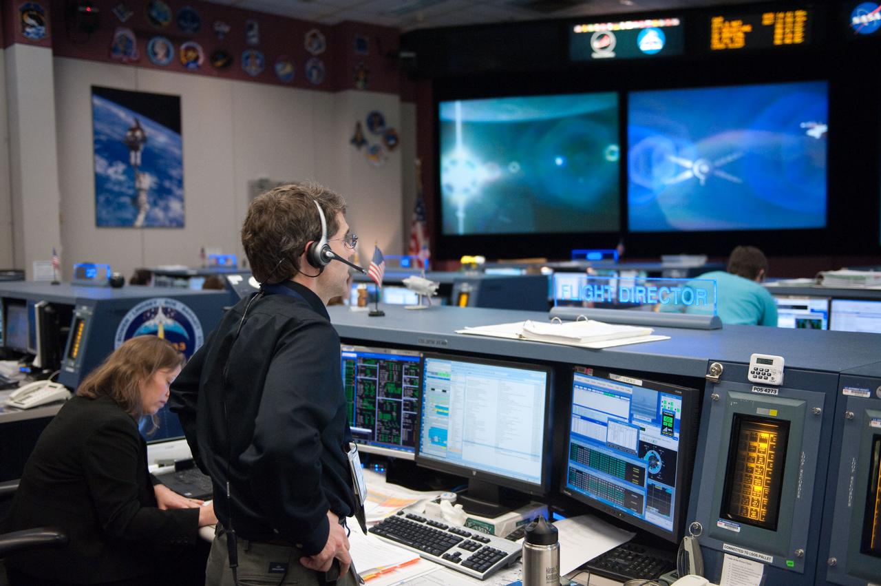 ISS Orbit 2 flight controllers on console with Flight Director Bob Dempsey during the ESA ATV docking to space station.  Photo Date: February 24, 2011.  Location: Building 30M, FCR-1.  Photographer: Robert Markowitz.