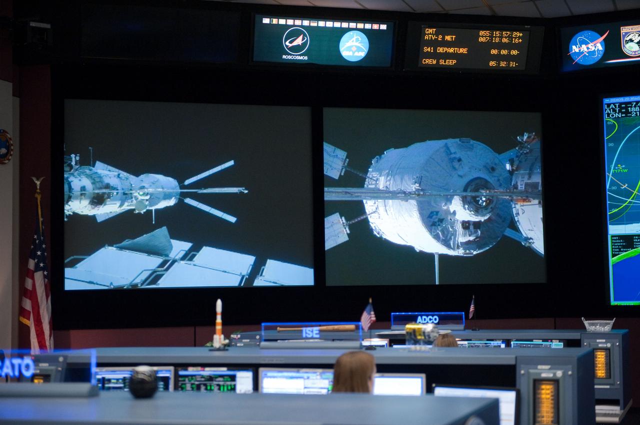 ISS Orbit 2 flight controllers on console with Flight Director Bob Dempsey during the ESA ATV docking to space station.  Photo Date: February 24, 2011.  Location: Building 30M, FCR-1.  Photographer: Robert Markowitz.