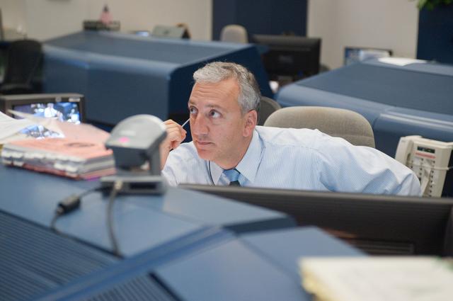 NASA image: STS-133/ULF5 Flight Controllers on Console - Orbit Shift 3/1