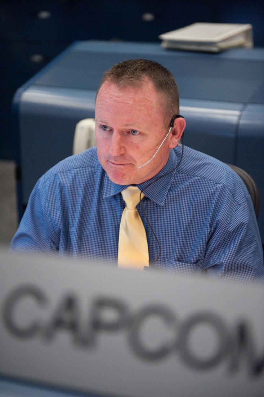 STS-133 flight controllers on console during the launch of Discovery with Flight Director Richard Jones.  Photo Date: February 24, 2011.  Location: Building 30 south - WFCR.  Photographer: Robert Markowitz.