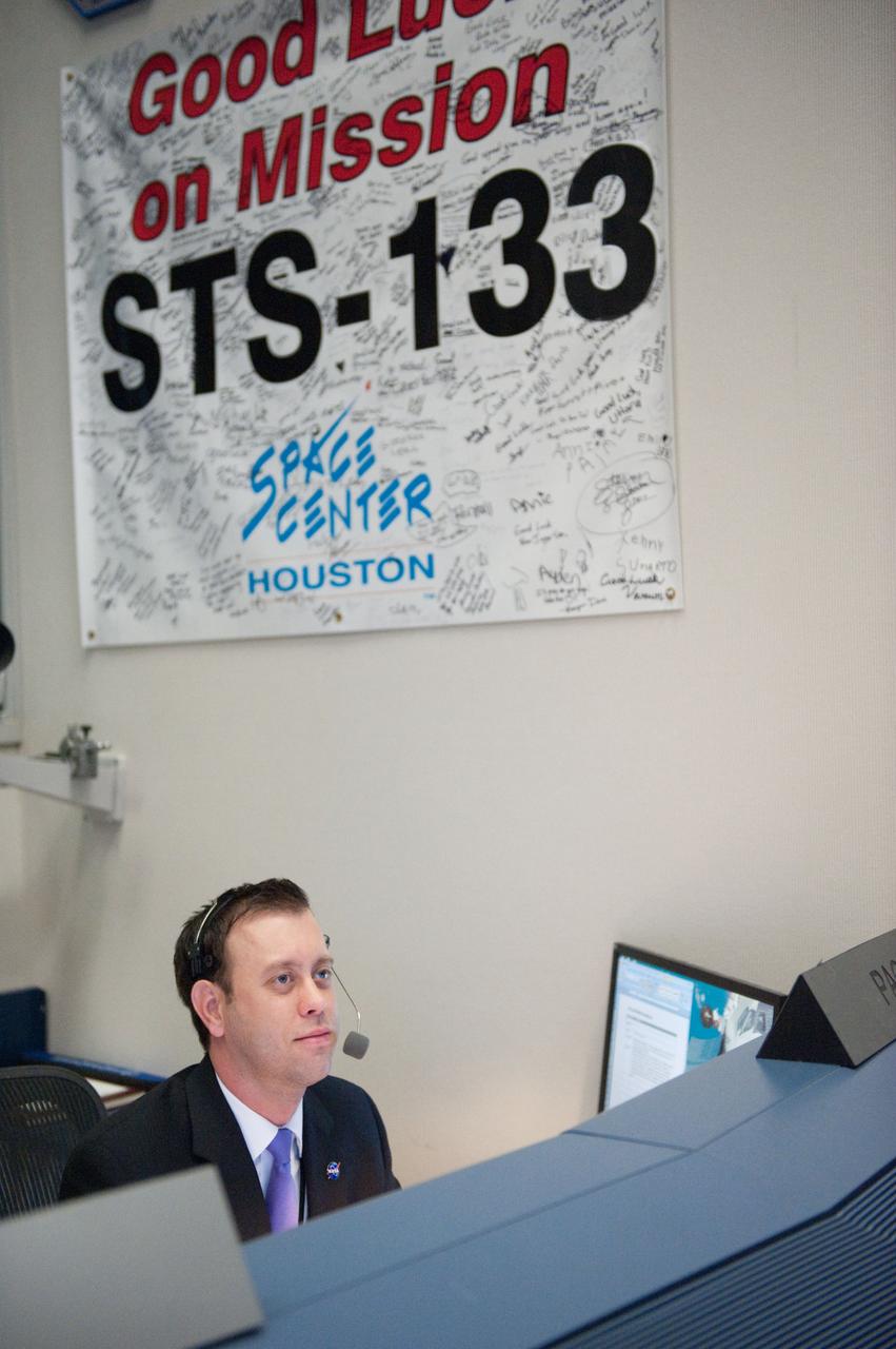 STS-133 flight controllers on console during the launch of Discovery with Flight Director Richard Jones.  Photo Date: February 24, 2011.  Location: Building 30 south - WFCR.  Photographer: Robert Markowitz.