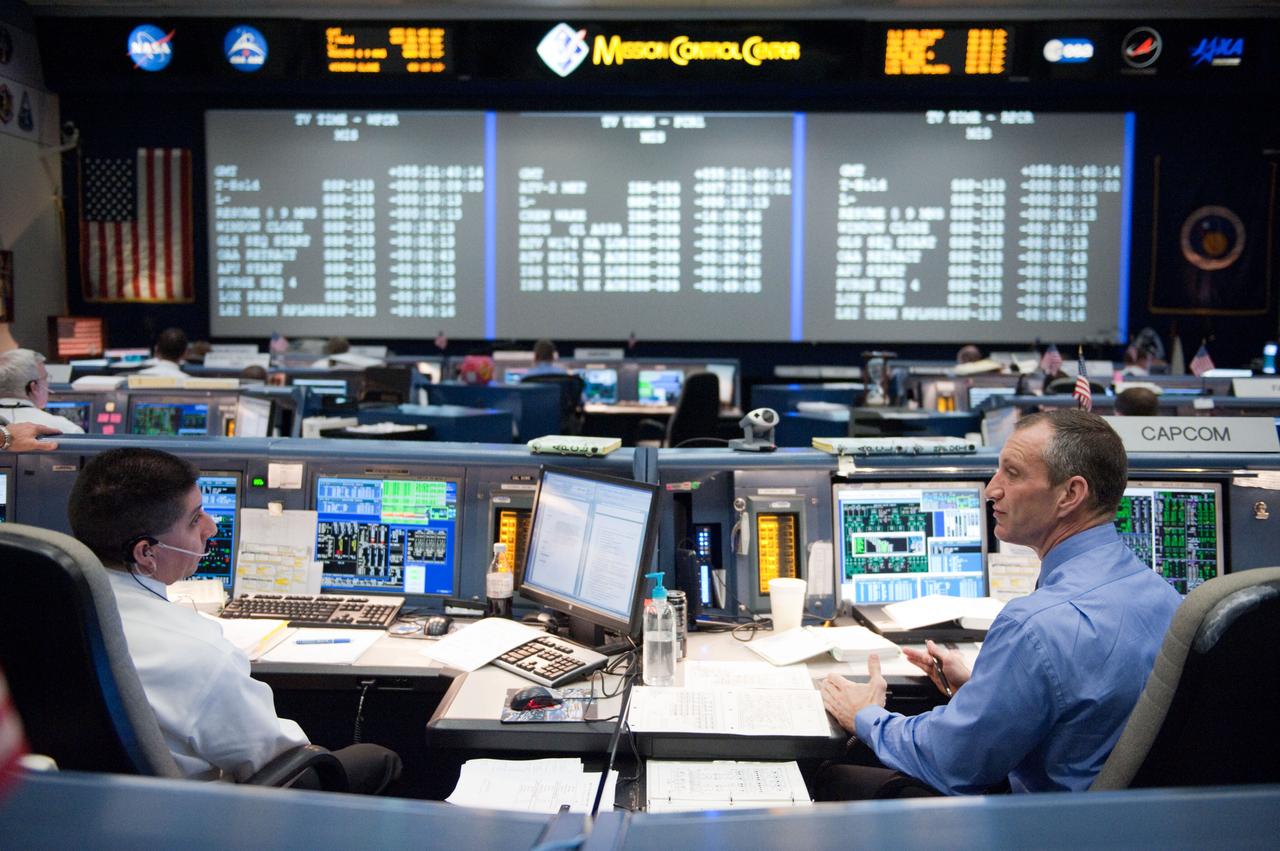 STS-133 flight controllers on console during the launch of Discovery with Flight Director Richard Jones.  Photo Date: February 24, 2011.  Location: Building 30 south - WFCR.  Photographer: Robert Markowitz.