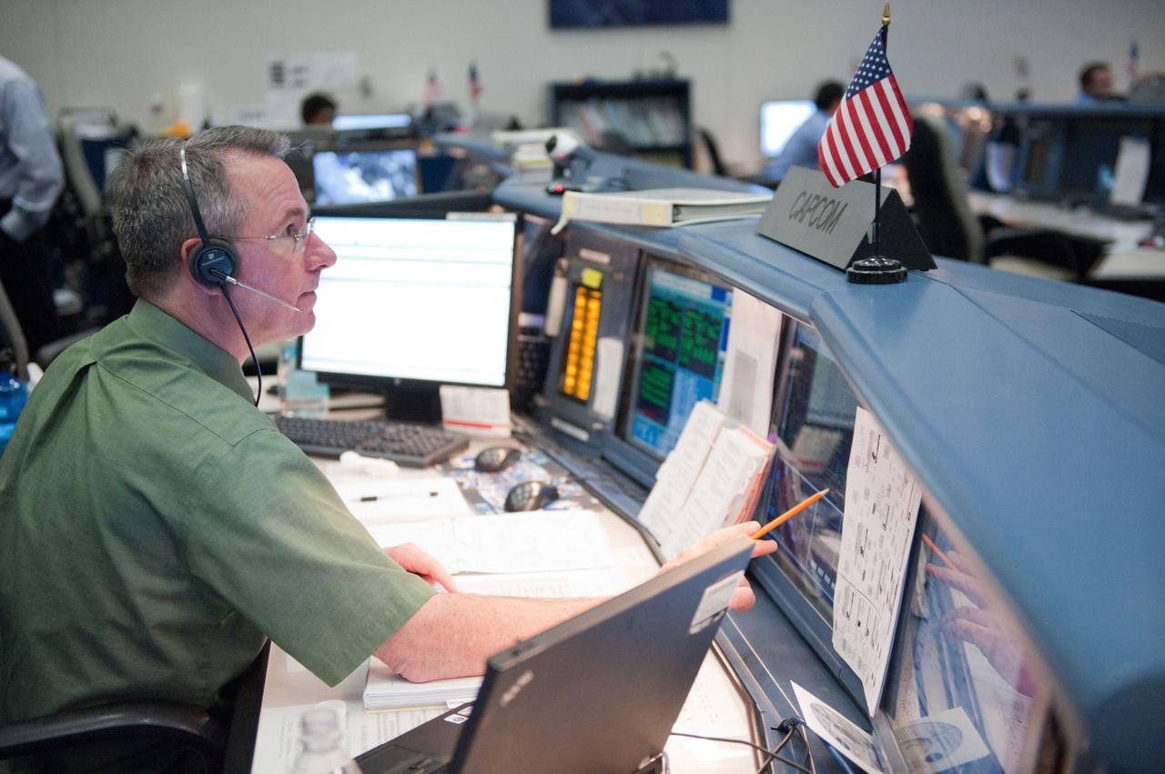 STS-133/ULF5 Orbit 1 flight controllers on console during unberth of Permanment Multipurpose Module (PMM) from shuttle. Photo Date: March 1, 2011. Location: Building 30 - WFCR and FCR-1. Photographer: Robert Markowitz.