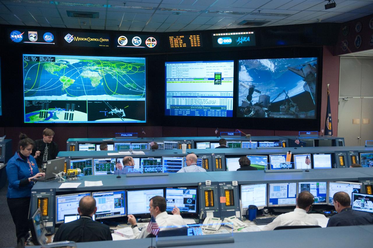 STS-133/ULF5 Orbit 1 flight controllers on console during unberth of Permanment Multipurpose Module (PMM) from shuttle. Photo Date: March 1, 2011. Location: Building 30 - WFCR and FCR-1. Photographer: Robert Markowitz.