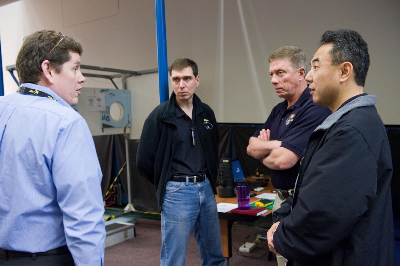 DATE: 3-15-11 LOCATION: Building 9 - ISS Mockup SUBJECT: Expedition 28/29 crew members during Docking Timeline Training. PHOTOGRAPHER: Lauren Harnett