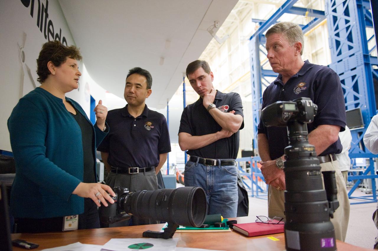 DATE: 3-15-11 LOCATION: Building 9 - ISS Mockup SUBJECT: Expedition 28/29 crew members during Docking Timeline Training. PHOTOGRAPHER: Lauren Harnett