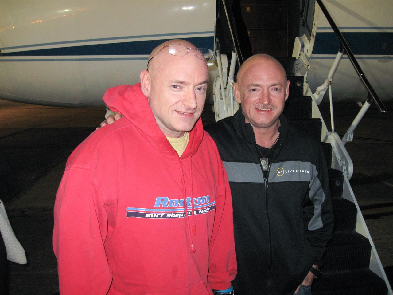 Expedition 26 Commander Scott Kelly (left) is reunited with his twin brother, Mark Kelly on March 17, 2010, following a flight back to Ellington Field, Houston from Kustanai, Kazakhstan. Scott Kelly landed in Kazakhstan on March 16 with his Russian crewmates in the Soyuz TMA-01M spacecraft after 159 days in space, 157 days on the International Space Station. Mark Kelly is in the final weeks of training as Commander of the final flight of Endeavour, STS-134, that will spend more than a week docked to the ISS. Endeavour is targeted for launch on April 19.  Credit: NASA/Rob Navias 
