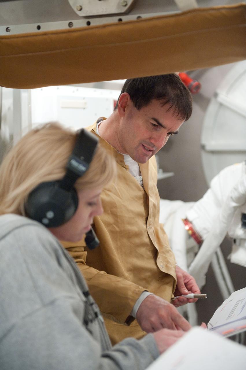 JSC2011-E-026862 (11 March 2011) --- NASA astronaut Rex Walheim, STS-135 mission specialist, participates in an Extravehicular Mobility Unit (EMU) spacesuit fit check in the Space Station Airlock Test Article (SSATA) in the Crew Systems Laboratory at NASA's Johnson Space Center. Photo credit: NASA or National Aeronautics and Space Administration