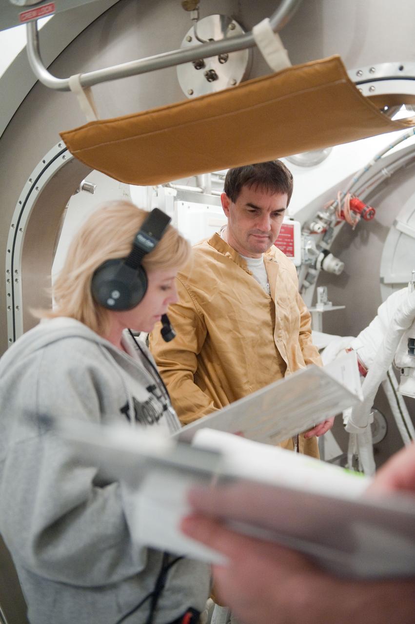 JSC2011-E-026863 (11 March 2011) --- NASA astronaut Rex Walheim, STS-135 mission specialist, participates in an Extravehicular Mobility Unit (EMU) spacesuit fit check in the Space Station Airlock Test Article (SSATA) in the Crew Systems Laboratory at NASA's Johnson Space Center. Photo credit: NASA or National Aeronautics and Space Administration