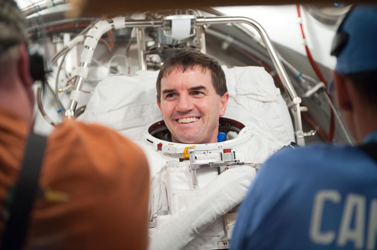 JSC2011-E-026867 (11 March 2011) --- NASA astronaut Rex Walheim, STS-135 mission specialist, participates in an Extravehicular Mobility Unit (EMU) spacesuit fit check in the Space Station Airlock Test Article (SSATA) in the Crew Systems Laboratory at NASA's Johnson Space Center. Photo credit: NASA or National Aeronautics and Space Administration