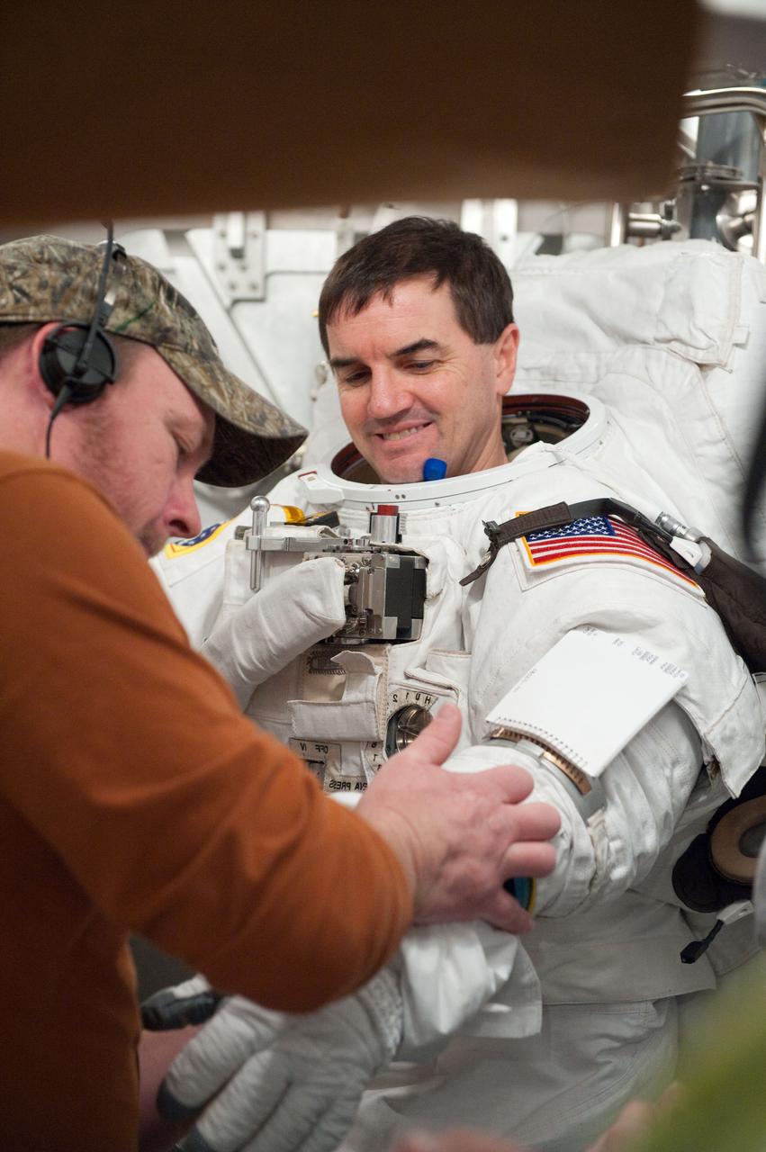 JSC2011-E-026871 (11 March 2011) --- NASA astronaut Rex Walheim, STS-135 mission specialist, participates in an Extravehicular Mobility Unit (EMU) spacesuit fit check in the Space Station Airlock Test Article (SSATA) in the Crew Systems Laboratory at NASA's Johnson Space Center. Photo credit: NASA or National Aeronautics and Space Administration