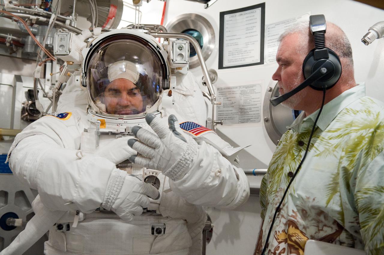 JSC2011-E-026887 (11 March 2011) --- NASA astronaut Rex Walheim, STS-135 mission specialist, participates in an Extravehicular Mobility Unit (EMU) spacesuit fit check in the Space Station Airlock Test Article (SSATA) in the Crew Systems Laboratory at NASA's Johnson Space Center. Photo credit: NASA or National Aeronautics and Space Administration