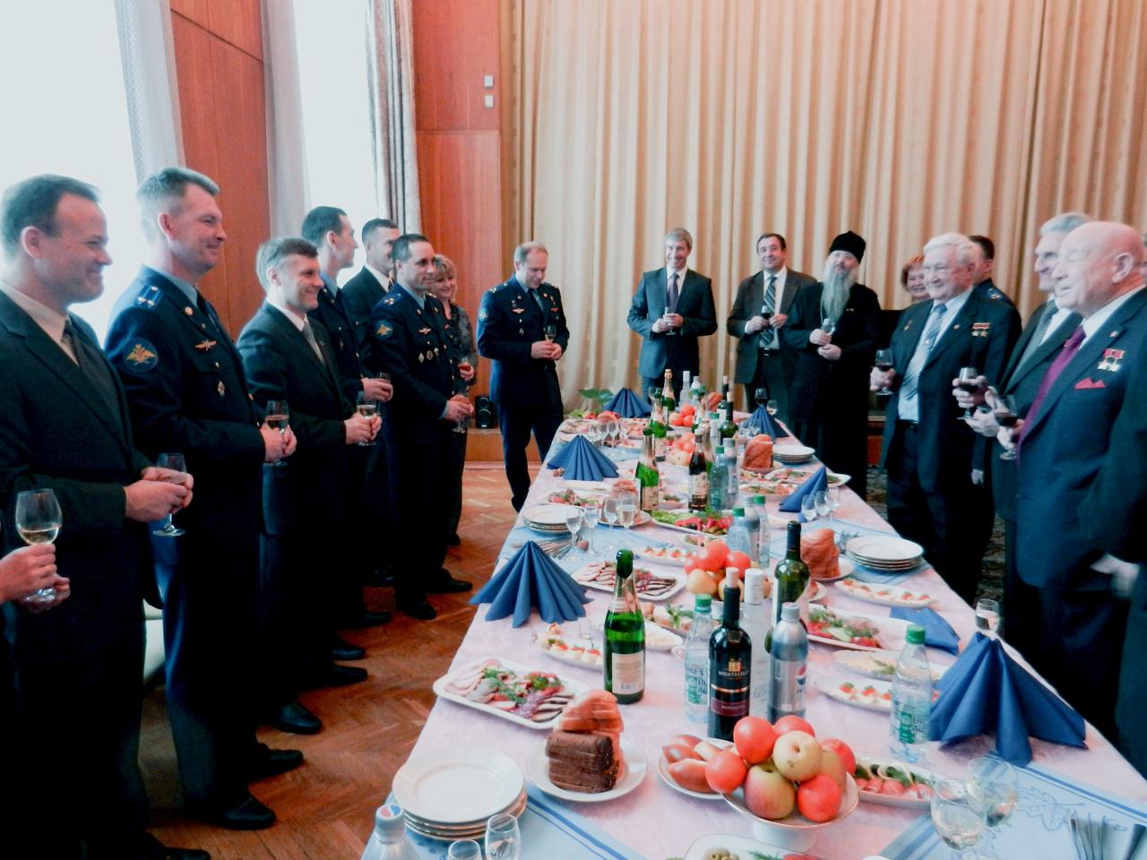 At the Gagarin Cosmonaut Training Center in Star City, Russia, famed Russian cosmonaut Alexei Leonov (right) toasted the Expedition 27 prime and backup crew members at a breakfast March 21, 2011 prior to their departure for their launch site at the Baikonur Cosmodrome in Kazakhstan. From left to right are prime crew members Ron Garan of NASA, flight engineer; Russian cosmonaut Alexander Samokutyaev, Soyuz commander; and Russian cosmonaut Andrey Borisenko, flight engineer, along with backup crew members Anatoly Ivanishin and Anton Shklaperov of Russia and Daniel Burbank of NASA.  Garan, Samokutyaev and Borisenko are scheduled to launch April 5 (Kazakhstan time) on the Soyuz TMA-21 spacecraft to the International Space Station. Photo credit: NASA/Stephanie Stoll
