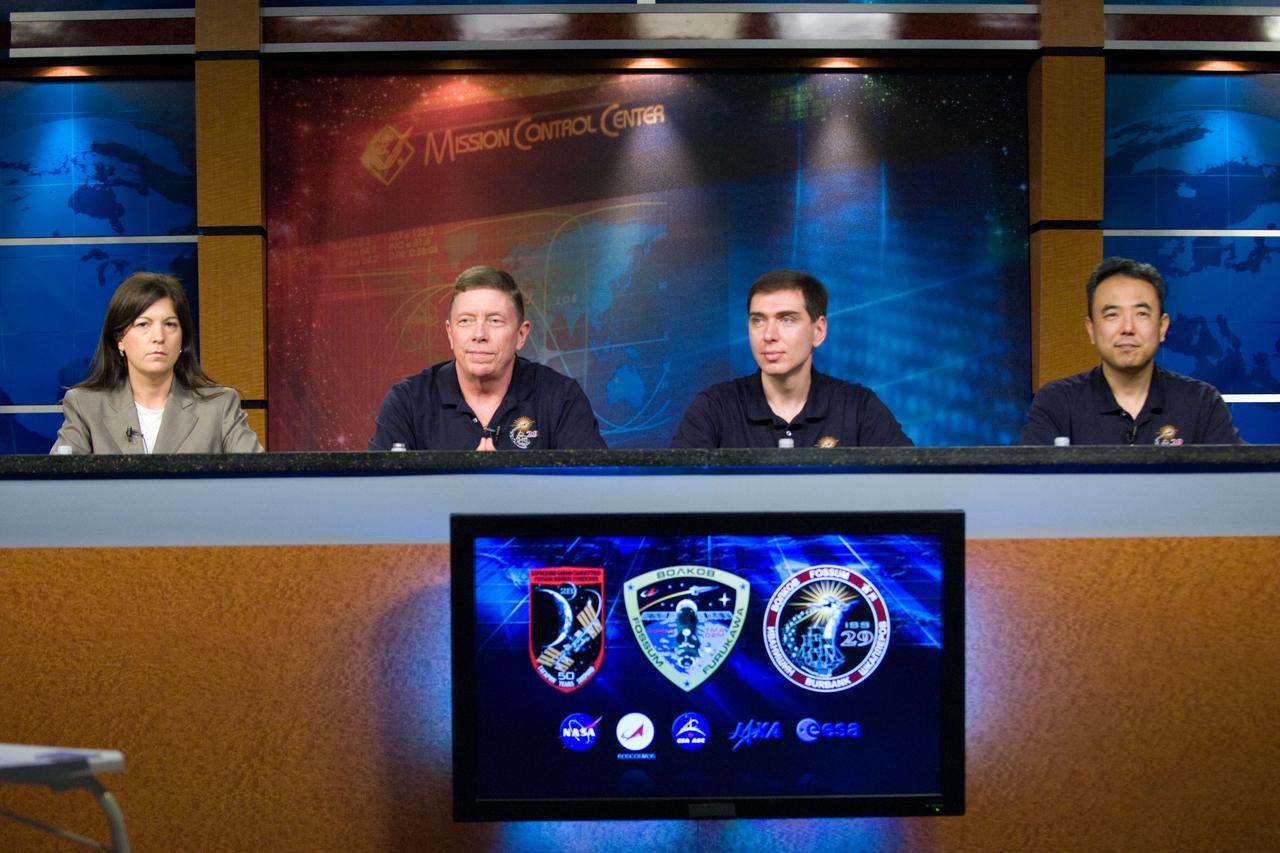 JSC2011-E-027603 (21 March 2011) --- NASA astronaut Mike Fossum (second left), Expedition 28 flight engineer and Expedition 29 commander; Russian cosmonaut Sergei Volkov and Japan Aerospace Exploration Agency (JAXA) astronaut Satoshi Furukawa (right), both Expedition 28/29 flight engineers, participate in an Expedition 28/29 preflight press conference at NASA's Johnson Space Center. Public Affairs Office moderator Nicole Cloutier is at left. Photo credit: NASA or National Aeronautics and Space Administration