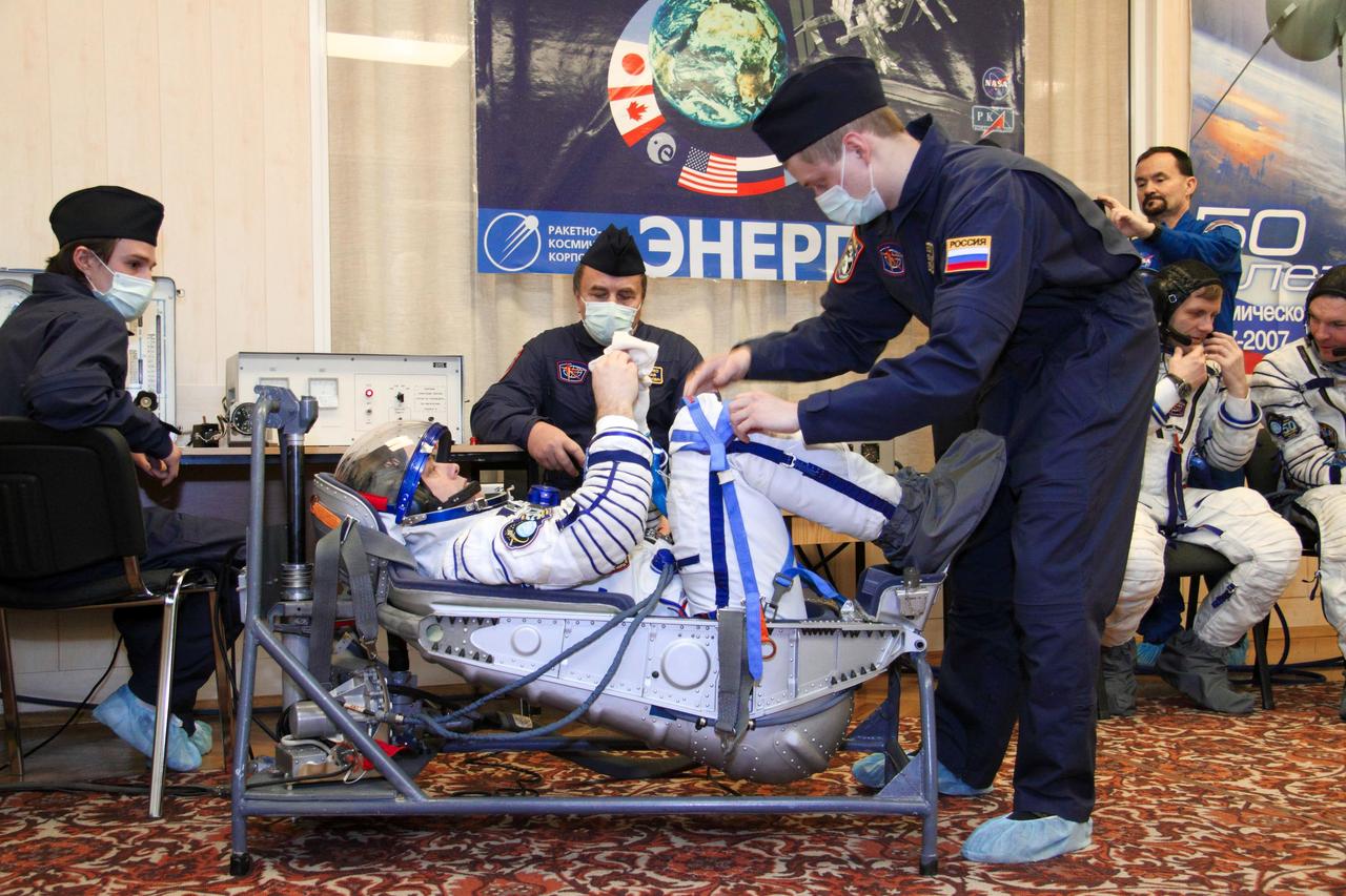 At the Baikonur Cosmodrome in Kazakhstan, Expedition 27 Flight Engineer Ron Garan of NASA conducts a leak check of his Russian Sokol launch and entry suit during a dress rehearsal of launch activities March 22, 2011. Garan, Soyuz Commander Alexander Samokutyaev and Flight Engineer Andrey Borisenko are scheduled to launch April 5 (April 4, U.S. time) in the Soyuz TMA-21 spacecraft that has been dubbed “Gagarin” in honor of the 50th anniversary of the launch of Yuri Gagarin as the first human in space from the same launch pad that the Expedition 27 will begin its journey from. NASA/Victor Zelentsov