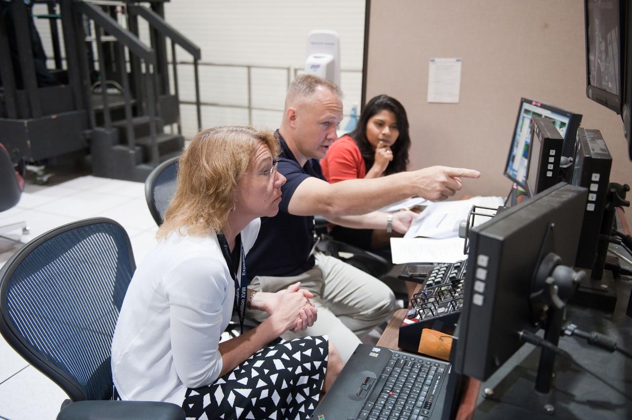 JSC2011-E-028122 (23 March 2011) --- NASA astronauts Doug Hurley, STS-135 pilot; and Sandy Magnus (foreground), mission specialist, participate in an exercise in the systems engineering simulator in the Avionics Systems Laboratory at NASA's Johnson Space Center. Photo credit: NASA or National Aeronautics and Space Administration
