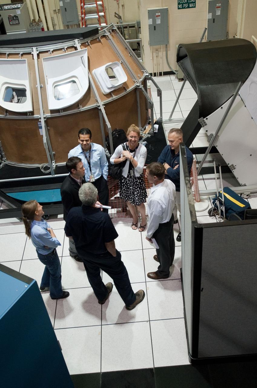JSC2011-E-028126 (23 March 2011) --- NASA astronauts Chris Ferguson, STS-135 commander; Doug Hurley, pilot; and Sandy Magnus, mission specialist, are pictured during an STS-135 media day event in the Avionics Systems Laboratory at NASA's Johnson Space Center. Photo credit: NASA or National Aeronautics and Space Administration