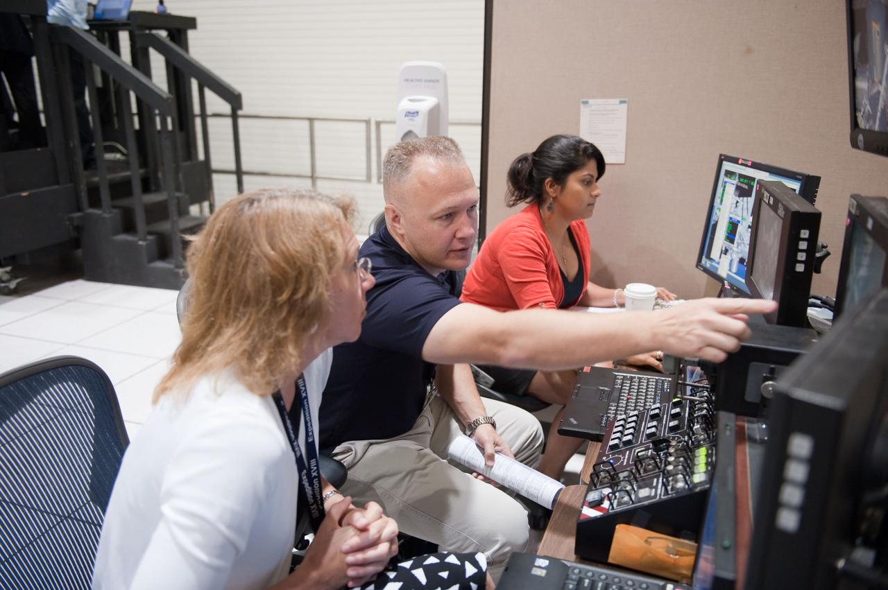 JSC2011-E-028151 (23 March 2011) --- NASA astronauts Doug Hurley, STS-135 pilot; and Sandy Magnus (foreground), mission specialist, participate in an exercise in the systems engineering simulator in the Avionics Systems Laboratory at NASA's Johnson Space Center. Photo credit: NASA or National Aeronautics and Space Administration