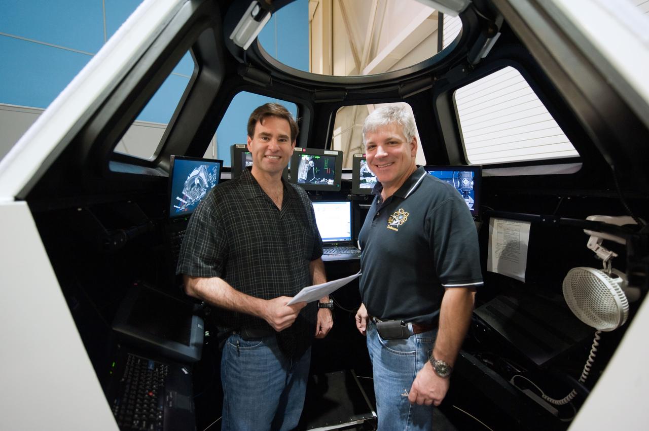 JSC2011-E-028160 (23 March 2011) --- NASA astronauts Greg H. Johnson (right), STS-134 pilot; and Greg Chamitoff, mission specialist, are pictured during an exercise in the systems engineering simulator in the Avionics Systems Laboratory at NASA's Johnson Space Center. Photo credit: NASA or National Aeronautics and Space Administration
