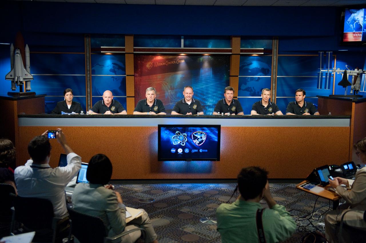 JSC2011-E-028489 (24 March 2011) --- The STS-134 crew members along with Public Affairs Office moderator Nicole Cloutier (left) are pictured during a preflight press conference at NASA's Johnson Space Center. From the second left are NASA astronauts Mark Kelly, commander; Greg H. Johnson, pilot; and Michael Fincke, European Space Agency?s Roberto Vittori, and NASA astronauts Andrew Feustel and Greg Chamitoff, all mission specialists. News media representatives are visible in the foreground. Photo credit: NASA or National Aeronautics and Space Administration