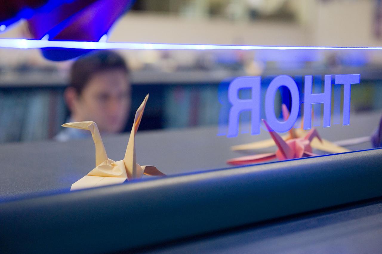 PHOTO DATE:  3-25-11 LOCATION:   Bldg. 30M, FCR-1 SUBJECT: JAXA flight control team gave the Folding Paper Cranes to NASA ISS mission control team and now they are decorated on their consoles.  The Folding Paper Cranes are for the people who suffer terrible pain from the earthquake in Japan. PHOTOGRAPHER:   Lauren Harnett