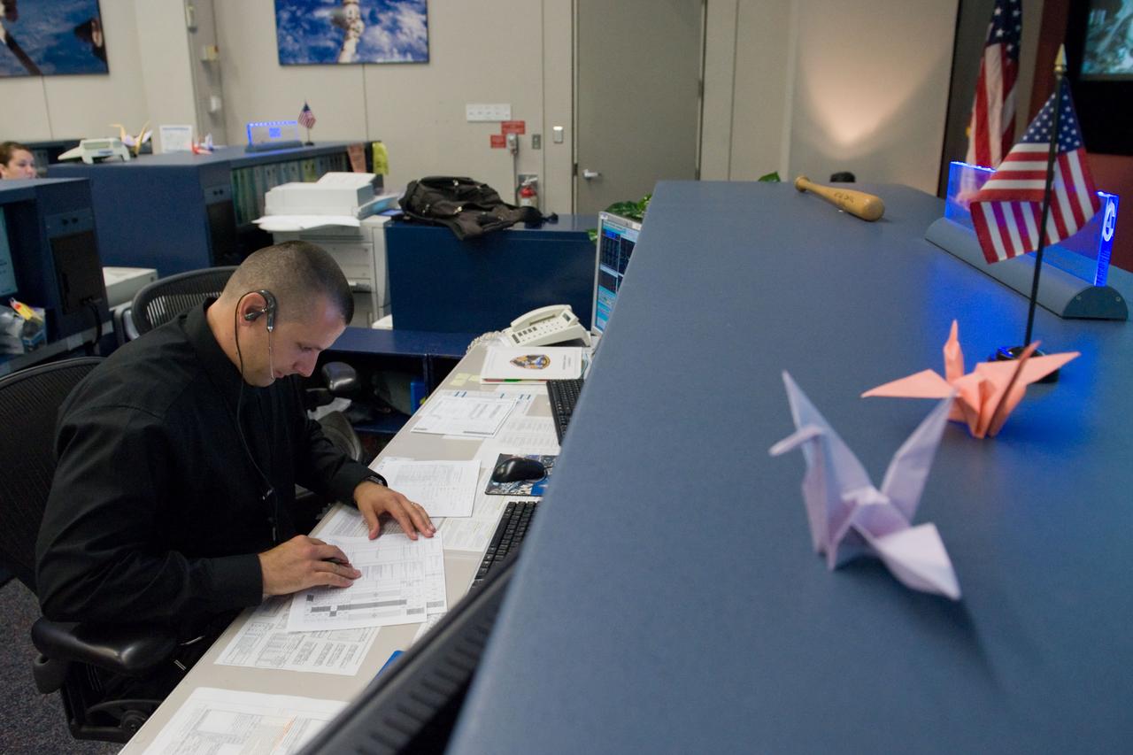 PHOTO DATE:  3-25-11 LOCATION:   Bldg. 30M, FCR-1 SUBJECT: JAXA flight control team gave the Folding Paper Cranes to NASA ISS mission control team and now they are decorated on their consoles.  The Folding Paper Cranes are for the people who suffer terrible pain from the earthquake in Japan. PHOTOGRAPHER:   Lauren Harnett