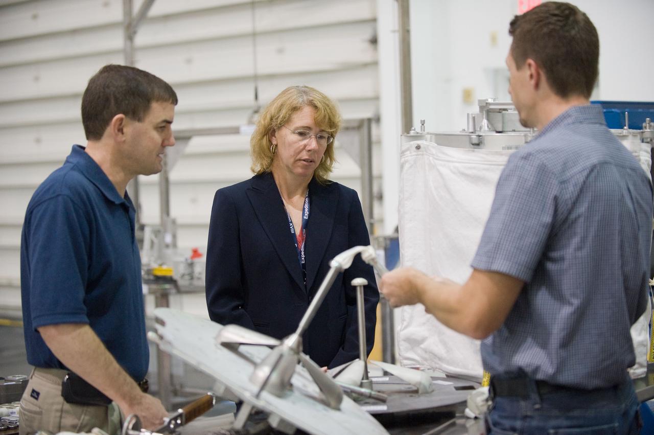 JSC2011-E-029011 (21 March 2011) --- NASA astronauts Rex Walheim (left) and Sandy Magnus, both STS-135 mission specialists, participate in an extravehicular activity (EVA) hardware training session in the Neutral Buoyancy Laboratory (NBL) near NASA's Johnson Space Center. EVA instructor Art Thomason assisted Walheim and Magnus. STS-135 is planned to be the final mission of the space shuttle program. Photo credit: NASA or National Aeronautics and Space Administration