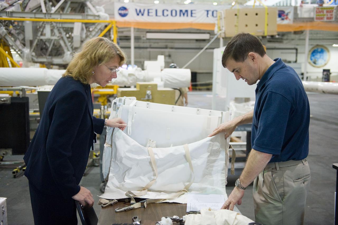JSC2011-E-029038 (21 March 2011) --- NASA astronauts Sandy Magnus and Rex Walheim, both STS-135 mission specialists, participate in an extravehicular activity (EVA) hardware training session in the Neutral Buoyancy Laboratory (NBL) near NASA's Johnson Space Center. STS-135 is planned to be the final mission of the space shuttle program. Photo credit: NASA or National Aeronautics and Space Administration