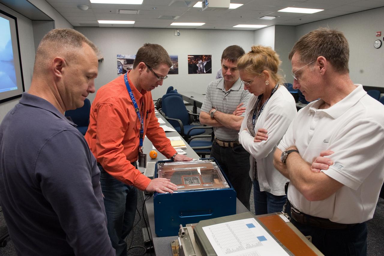 JSC2011-E-029131 (25 March 2011) --- STS-135 crew members participate in an Animal Enclosure Module (AEM) training session in the Jake Garn Simulation and Training Facility at NASA's Johnson Space Center. Pictured on the right (front to back) are NASA astronauts Chris Ferguson, commander; Sandy Magnus and Rex Walheim, both mission specialists; along with Doug Hurley (left foreground), pilot. STS-135 is planned to be the final mission of the space shuttle program. Photo credit: NASA or National Aeronautics and Space Administration