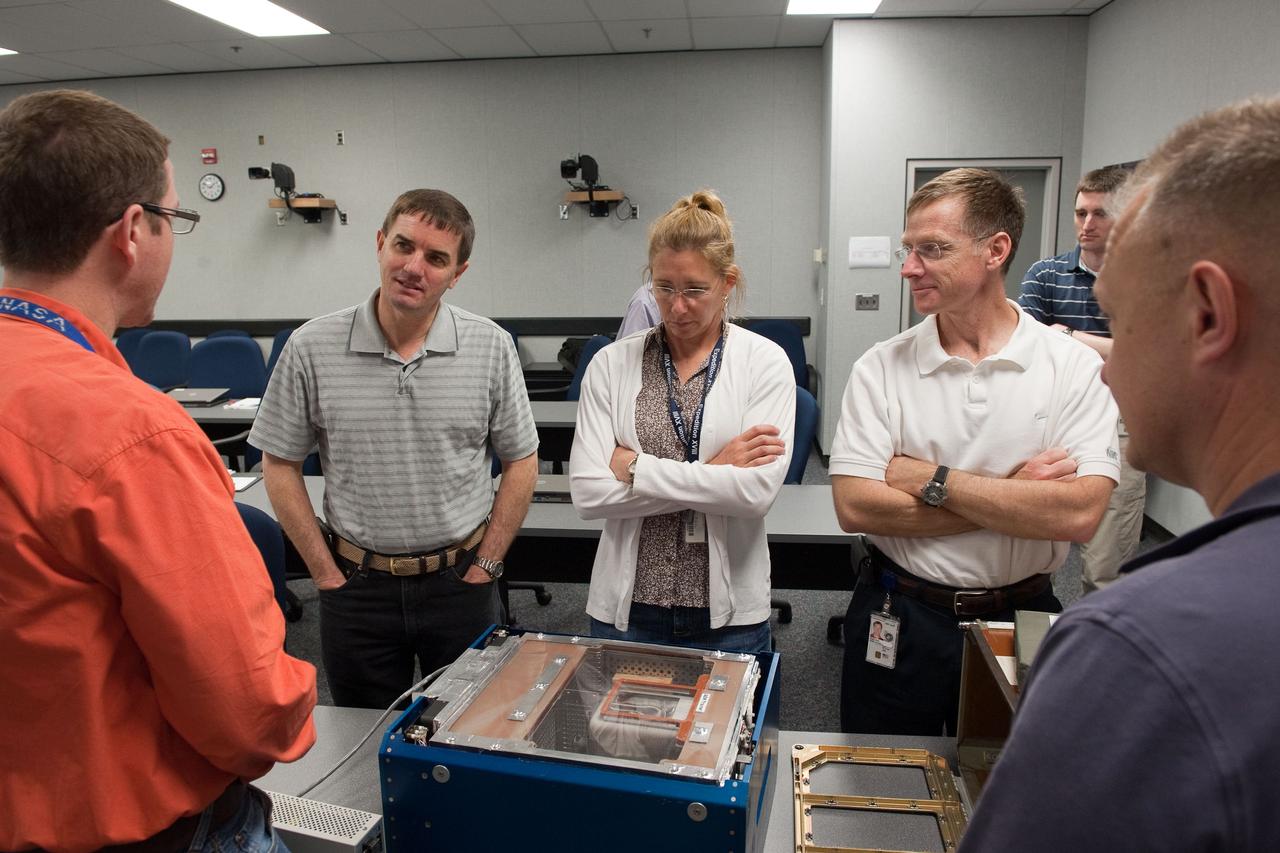 JSC2011-E-029132 (25 March 2011) --- STS-135 crew members participate in an Animal Enclosure Module (AEM) training session in the Jake Garn Simulation and Training Facility at NASA's Johnson Space Center. Pictured from the left (facing camera) are NASA astronauts Rex Walheim and Sandy Magnus, both mission specialists; and Chris Ferguson, commander; along with Doug Hurley (right foreground), pilot. STS-135 is planned to be the final mission of the space shuttle program. Photo credit: NASA or National Aeronautics and Space Administration