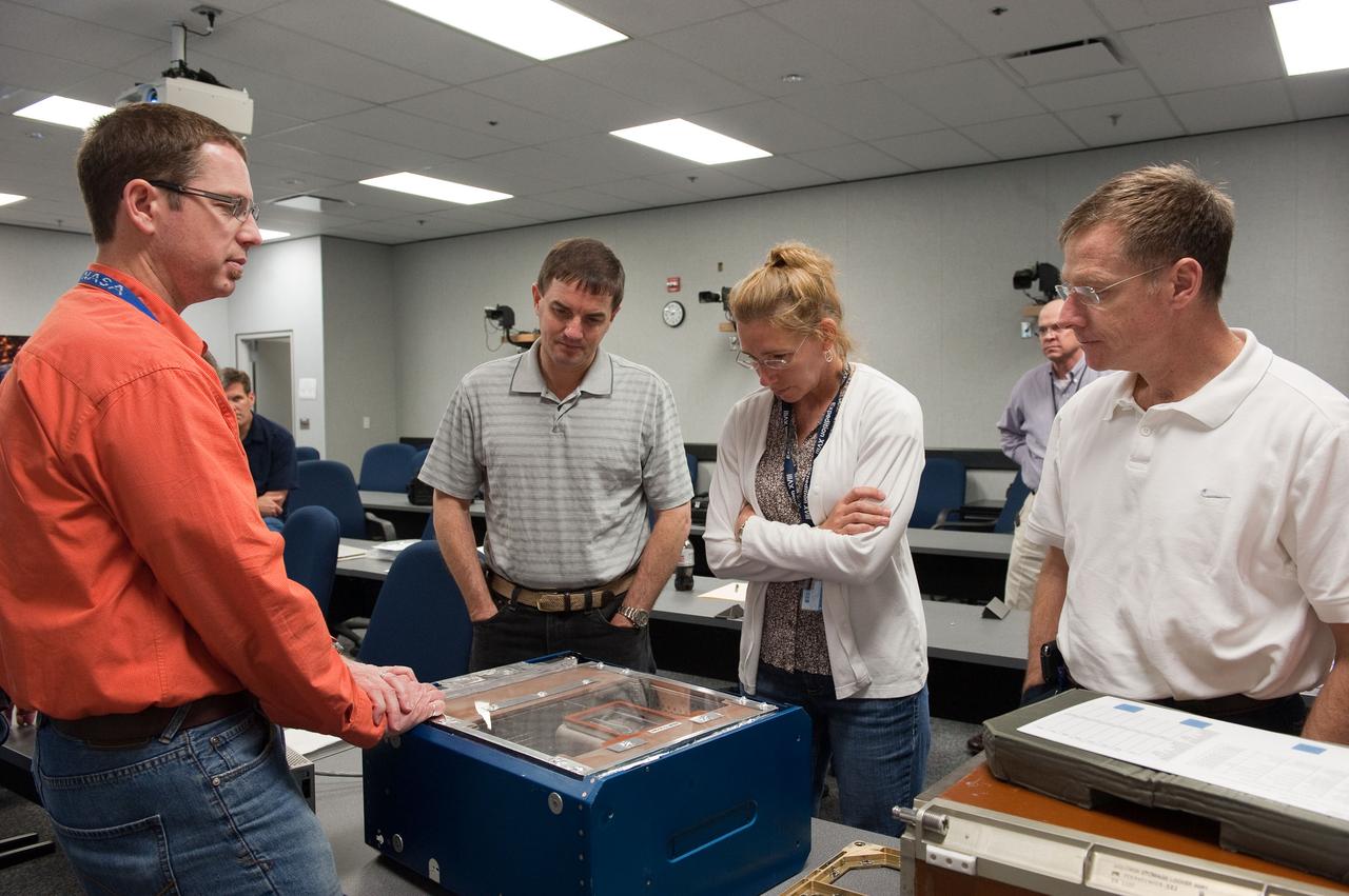 JSC2011-E-029133 (25 March 2011) --- STS-135 crew members participate in an Animal Enclosure Module (AEM) training session in the Jake Garn Simulation and Training Facility at NASA's Johnson Space Center. Pictured from the right are NASA astronauts Chris Ferguson, commander; Sandy Magnus and Rex Walheim, both mission specialists. STS-135 is planned to be the final mission of the space shuttle program. Photo credit: NASA or National Aeronautics and Space Administration