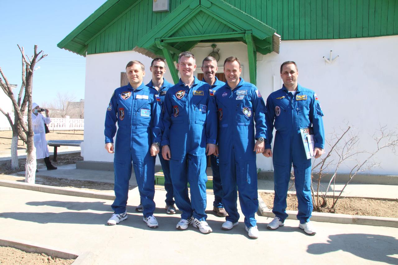JSC2011-E-030087 (31 March 2011) --- The Expedition 27 prime and backup crew members pose for pictures March 31, 2011 at the Baikonur Cosmodrome in Kazakhstan in front of the cottage near the launch pad in which Yuri Gagarin slept the night before he launched April 12, 1961 to become the first human to fly in space. NASA astronaut Ron Garan, flight engineer; Russian cosmonaut Alexander Samokutyaev, Soyuz commander, and Russian cosmonaut Andrey Borisenko, flight engineer, will launch April 5 (Kazakhstan time) in their Soyuz TMA-21 spacecraft to the International Space Station. Their Soyuz has been dubbed ?Gagarin? in honor of the 50th anniversary of Gagarin?s launch. From left to right are Borisenko, backup crew member Anatoly Ivanishin, Samokutyaev, backup crew member Dan Burbank, Garan and backup crew member Anton Shkaplerov. Photo credit: NASA/Victor Zelentsov