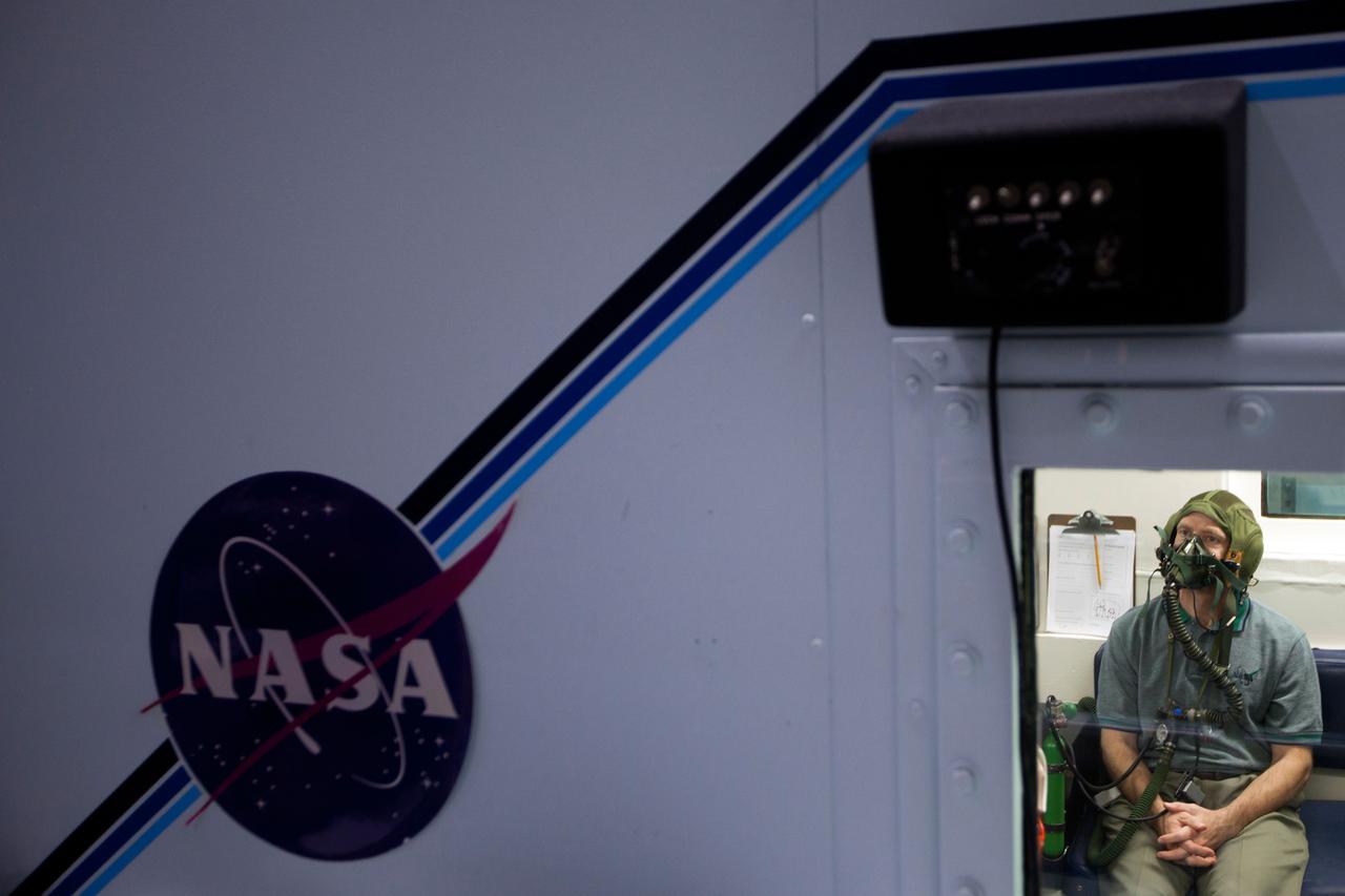 JSC2011-E-040206 (10 March 2011) --- NASA astronaut Chris Ferguson, STS-135 commander, sits in a hyperbaric chamber as he undergoes  high altitude training March 10, 2011 at the Sonny Carter Training Facility near the Johnson Space Center in Houston. Photo credit:  NASA Photo/Houston Chronicle, Smiley N. Pool