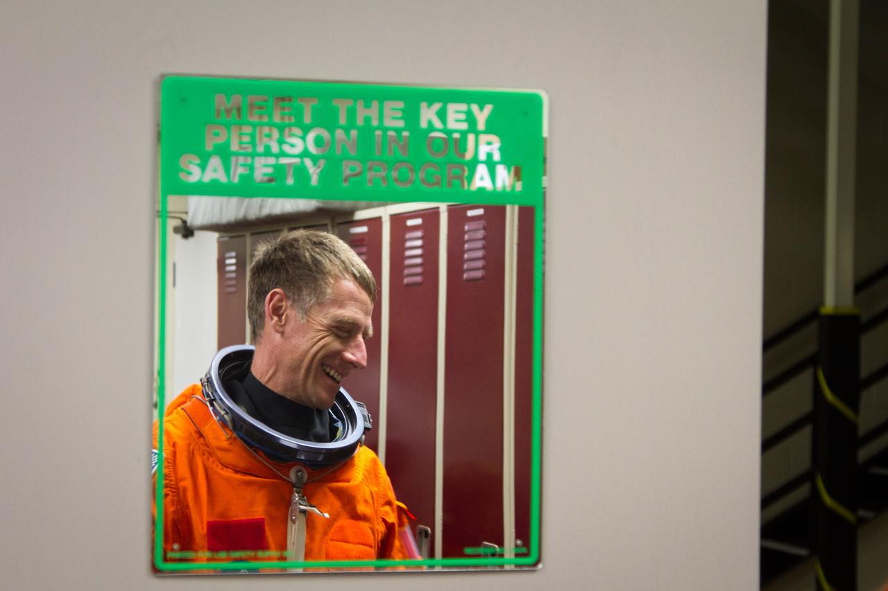 JSC2011-E-040273 (24 March 2011) --- NASA astronaut Chris Ferguson, STS-135 commander, is reflected in a mirror before participating in a post-insertion training session in the Full-Fuselage Trainer in the Space Vehicle Mock-up Facility at NASA's Johnson Space Center in Houston March 24, 2011. Photo credit: NASA Photo/Houston Chronicle, Smiley N. Pool