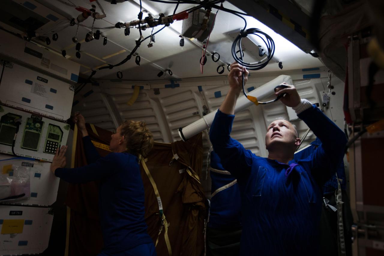 JSC2011-E-040284 (24 March 2011) --- NASA astronauts Doug Hurley and Sandy Magnus set up the middeck in the Full-Fuselage Trainer as the crew of STS-135 participates in a post insertion training session March 24, 2011 in the Space Vehicle Mock-up Facility at NASA's Johnson Space Center in Houston. Hurley is the pilot and Magnus is one of two mission specialists assigned to the flight. Photo credit: NASA Photo/Houston Chronicle, Smiley N. Pool