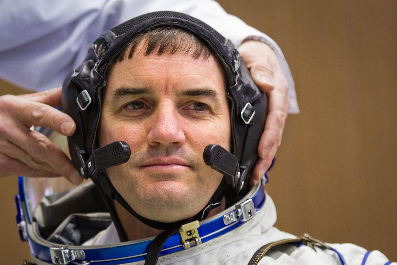 JSC2011-E-040298 (28 March 2011) --- NASA astronaut Rex Walheim, STS-135 mission specialist, undergoes a fit check of his Sokol spacesuit at the Zvezda facility in Moscow on March 28, 2011. The crew of the final shuttle mission traveled to Moscow for a suit fit check of their Russian suits would be required in the event of an emergency. Photo credit:  NASA Photo/Houston Chronicle, Smiley N. Pool