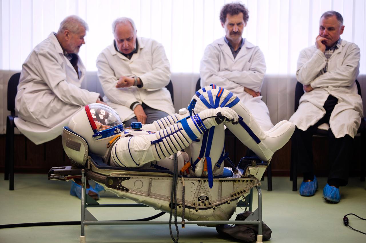 NASA astronaut Rex Walheim undergoes a fit check of his Sokol space suit at the Zvezda facility on Monday, March 28, 2011, in Moscow. The crew of the final shuttle mission traveled to Moscow for a suit fit check of their Russian Soyuz suits that will be required in the event of an emergency. ( NASA Photo / Houston Chronicle, Smiley N. Pool )