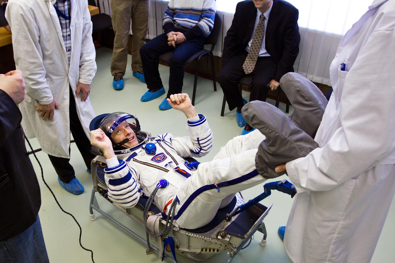 NASA astronaut Chris Ferguson undergoes a fit check of his Sokol space suit at the Zvezda facility on Tuesday, March 29, 2011, in Moscow. The crew of the final shuttle mission traveled to Moscow for a suit fit check of their Russian Soyuz suits that will be required in the event of an emergency. ( NASA Photo / Houston Chronicle, Smiley N. Pool )