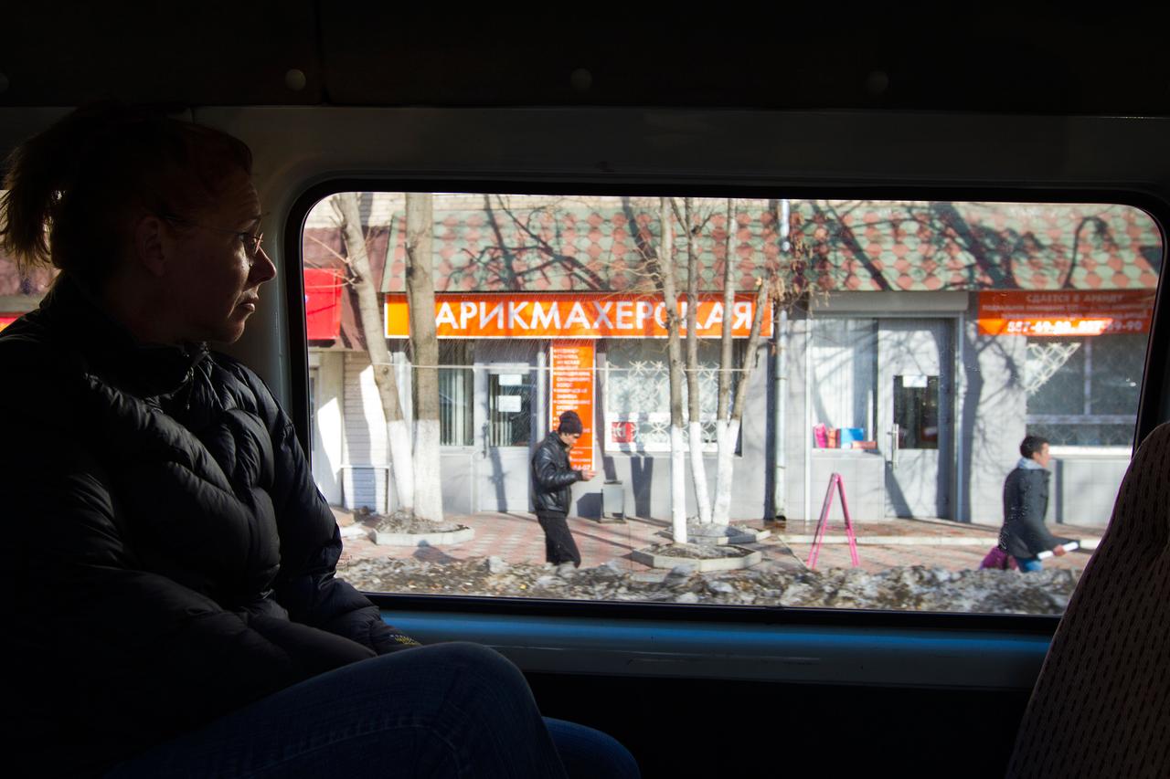 JSC2011-E-040323 (29 March 2011) --- NASA astronaut Sandy Magnus, STS-135 mission specialist, looks at a snow-covered neighborhood out the window of a van carrying her back to Star City following a fit check of her Sokol spacesuit at the Zvezda facility in Moscow March 29, 2011. The crew of the final shuttle mission traveled to Moscow for a suit fit check of their Russian spacesuits which would be required in the event of an emergency. Photo credit: NASA Photo/Houston Chronicle, Smiley N. Pool