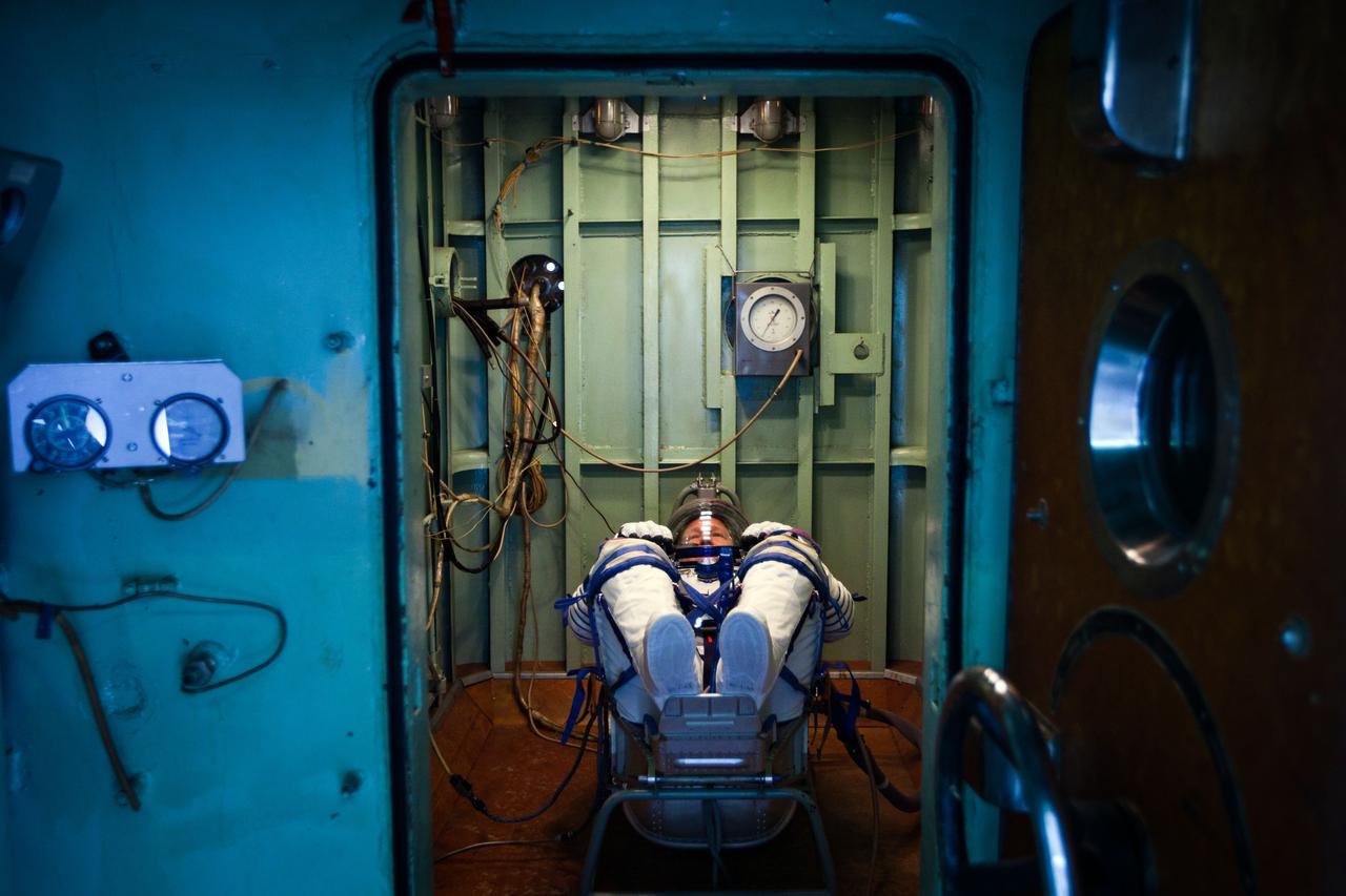 JSC2011-E-040324 (30 March 2011) --- NASA astronaut Doug Hurley, STS-135 pilot, waits in a pressure chamber before a test of his Russian Sokol spacesuit at the Zvezda facility in Moscow on March 30, 2011. The crew of the final shuttle mission traveled to Moscow for a suit fit check of their Russian Sokol suits which would be required in the event of an emergency. Photo credit: NASA Photo/Houston Chronicle, Smiley N. Pool
