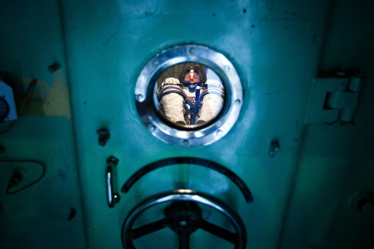 JSC2011-E-040325 (30 March 2011) --- NASA astronaut Doug Hurley, STS-135 pilot, waits in a pressure chamber before a test of his Sokol spacesuit at the Zvezda facility in Moscow March 30, 2011.  The crew of the final shuttle mission traveled to Moscow for a suit fit check of their Russian spacesuits which would be required in the event of an emergency.   Photo credit: NASA Photo/Houston Chronicle, Smiley N. Pool