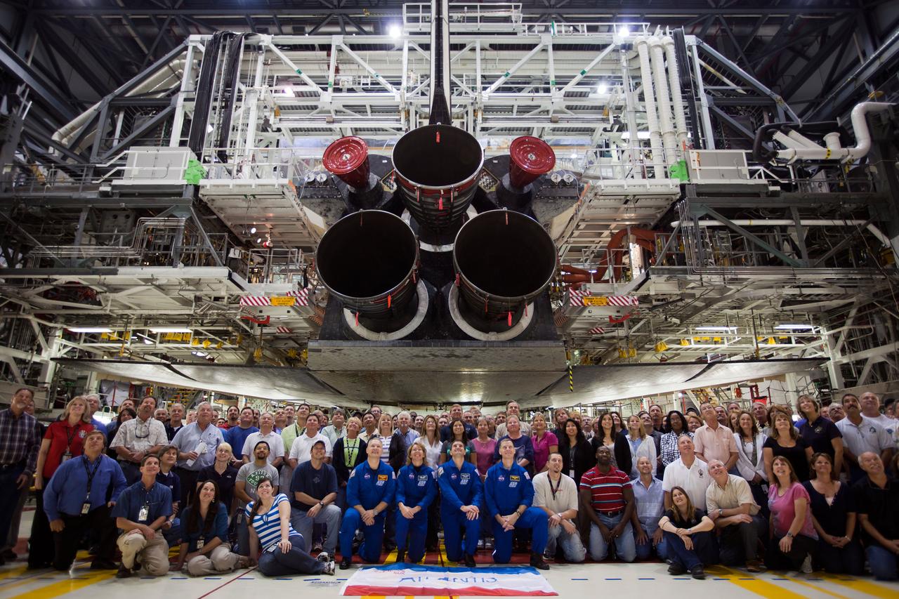 JSC2011-E-040339 (7 April 2011) --- The STS-135 crew members pose for a group photo under the space shuttle Atlantis in the Orbiter Processing Facility during the Crew Equipment Interface Test (CEIT) at the Kennedy Space Center in Florida on April 7, 2011.  Photo credit: NASA Photo/Houston Chronicle, Smiley N. Pool