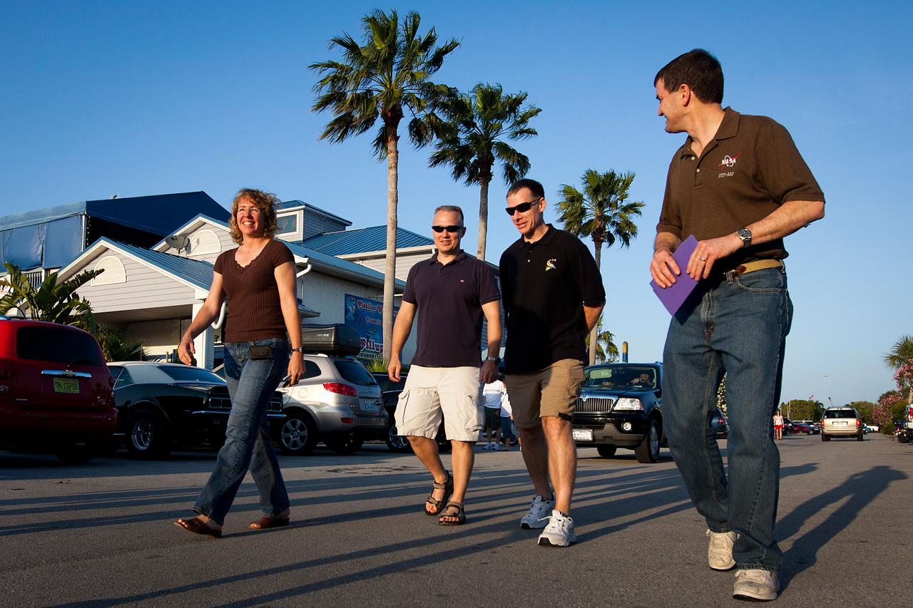JSC2011-E-040365 (7 April 2011) --- NASA astronauts, from left, Sandy Magnus, Doug Hurley, Chris Ferguson and Rex Walheim walk to dinner after an informal gathering for the STS-135 Crew Equipment Interface Test (CEIT) at the Fish Lips restaurant near NASA?s Kennedy Space Center in Florida on April 7, 2011. Photo credit: NASA Photo/Houston Chronicle, Smiley N. Pool