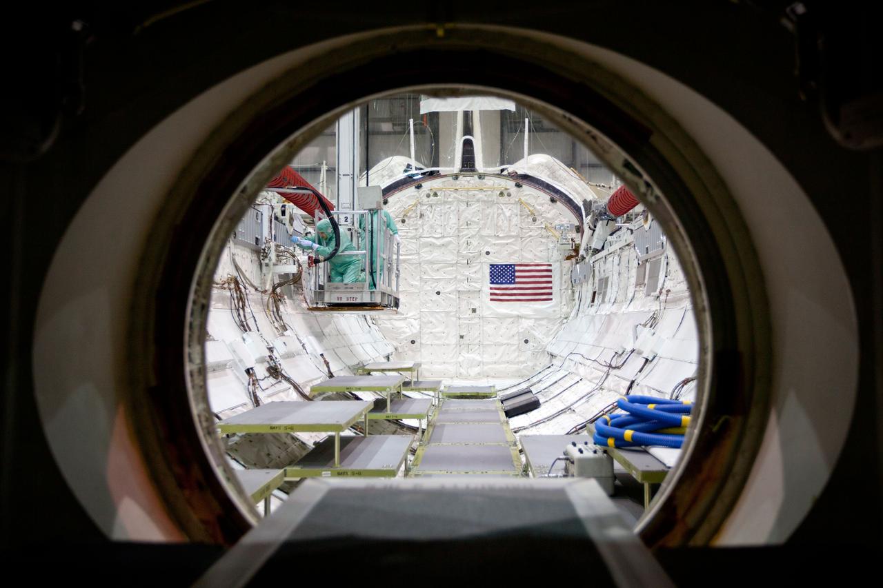 JSC2011-E-040372 (8 April 2011) --- Technicians inspect the payload bay of the space shuttle Atlantis during the STS-135 Crew Equipment Interface Test (CEIT) in the Orbiter Processing Facility at NASA?s Kennedy Space Center, Florida on April 8, 2011. Photo credit: NASA Photo/Houston Chronicle, Smiley N. Pool