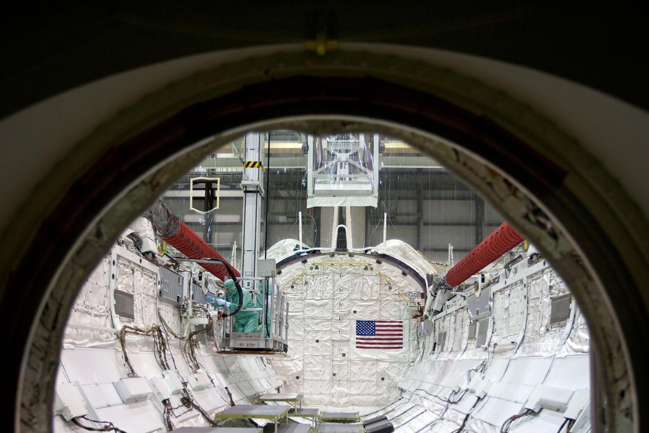 JSC2011-E-040373 (8 April 2011) --- Technicians inspect the payload bay of the space shuttle Atlantis during the STS-135 Crew Equipment Interface Test (CEIT) in the Orbiter Processing Facility at NASA?s Kennedy Space Center in Florida on April 8, 2011.  Photo credit:  NASA Photo/Houston Chronicle, Smiley N. Pool