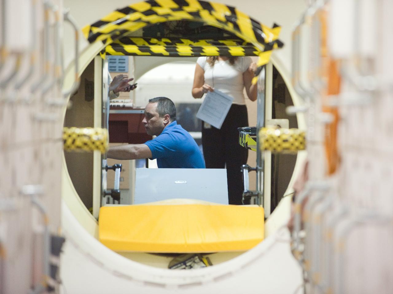 PHOTO DATE:  05-11-11 LOCATION:  Bldg 9NW, ISS Mockups SUBJECT:  Expedition 29/30 Emergency Ops training in ISS mockups WORK ORDER: 2011-1190 PHOTOGRAPHER: James Blair  