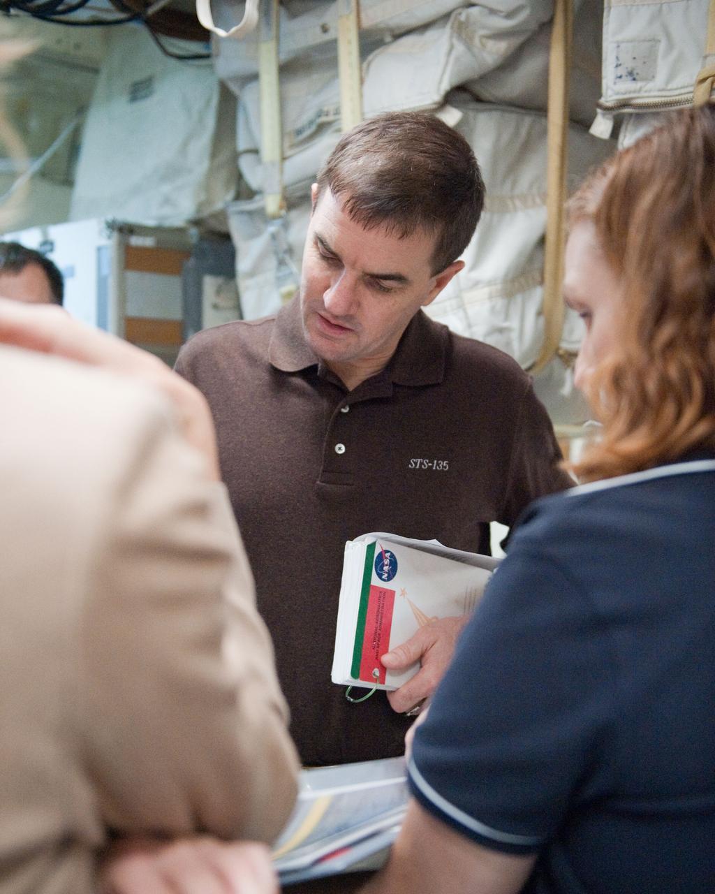 JSC2011-E-043685 (29 April 2011) --- NASA astronaut Rex Walheim, STS-135 mission specialist, participates in an ingress/egress timeline training session in the Space Vehicle Mock-up Facility at NASA's Johnson Space Center. Photo credit: NASA