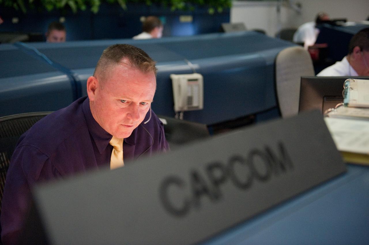 JSC2011-E-044083 (16 May 2011) --- Inside the space shuttle flight control room in Houston?s Mission Control Center, astronaut Barry Wilmore works at the spacecraft communicator (CAPCOM) console during the prelaunch and launch activities both at the Houston facility and the launch pad several hundred miles away in Florida. Space shuttle Endeavour lifted off from Pad 39A at NASA's Kennedy Space Center on time at 8:56 a.m. (EDT) on May 16, 2011. Photo credit: NASA